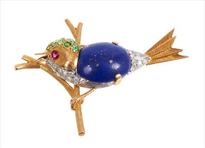 Lot 3479 - 18 ct yellow and white gold bird brooch with cabochon lapis lazuli body, demantoid garnet set head, diamonds in breast and tail and ruby eyes by E Wolfe & Co 8.4gms