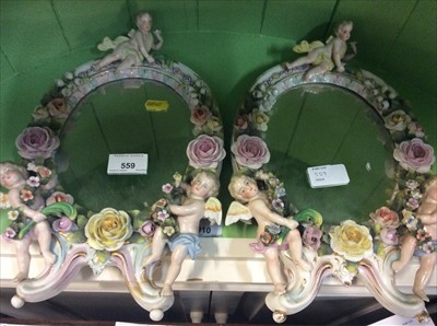 Lot 559 - Pair late 19th century Dresden porcelain mirrors