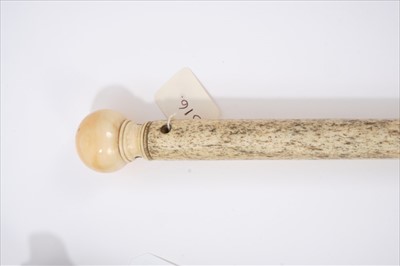 Lot 695 - Late 18th / early 19th century narwhal and ivory walking stick, with spherical carved ivory handle on tapering shaft, 83cm long