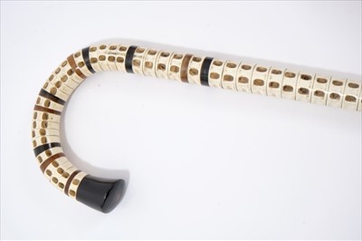 Lot 701 - 19th century shark's vertebrae walking stick, with crook handle and horn segments and ferrule, 90cm long