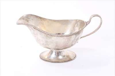 Lot 213 - 1920s silver sauce boat of helmet form