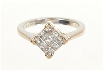 Lot 384 - 18ct white gold and diamond cluster ring, the square cluster comprising 9 invisibly set princess cut diamonds estimated to weigh approximately 0.90-1.00ct