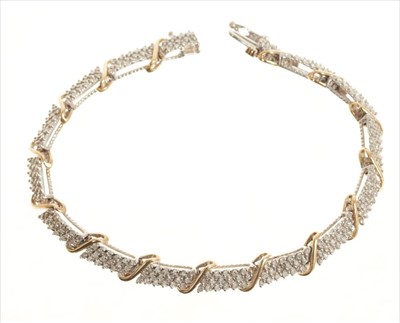 Lot 385 - 9ct white and yellow gold articulated bracelet with pavé set diamond panels. Estimated total diamond weight approximately 2.00ct