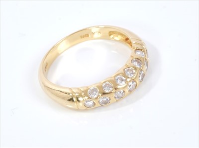 Lot 386 - 18ct diamond ring with a triple row of brilliant cut diamonds estimated to weigh approximately 0.64ct