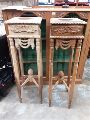 Lot 1005 - Pair of carved wood urn stands
