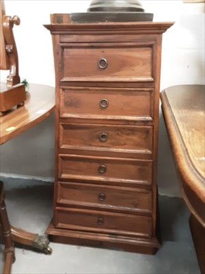 Lot 1011 - Indian teak pyramidal chest of drawers, together with a similar chest of drawers