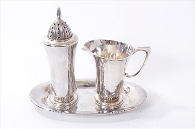 Lot 285 - Robert Stone for Garrards - three piece silver sugar and cream set
