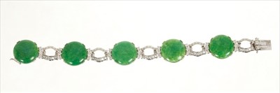 Lot 456 - Jadeite and diamond bracelet comprising five circular jadeite cabochonsflanked by brilliant cut diamonds, each panel interspaced by diamond links, all in 18ct white gold setting. Estimated total di...