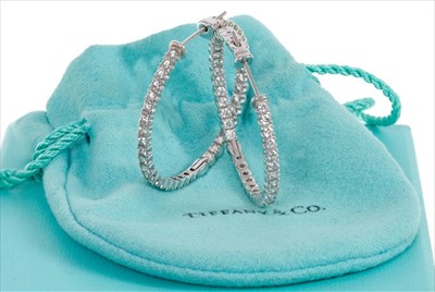 Lot 379 - Tiffany & Co. pair of Metro Hoop Earrings