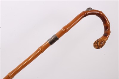 Lot 731 - Edwardian silver mounted whangee bamboo walking stick by Brigg, crook handle with root terminal, the shoulder with concealed retractable pencil with hinged cover, silver collar engraved with initia...