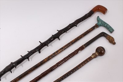 Lot 736 - Anglo-Chinese cloisonné mounted walking stick, the angular handle with dragon terminal, bamboo shaft with brass, ferrule, together with a grate mounted stick, blackthorn stick with angular carved h...