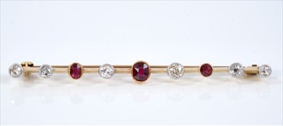 Lot 411 - Diamond and ruby nine stone bar brooch