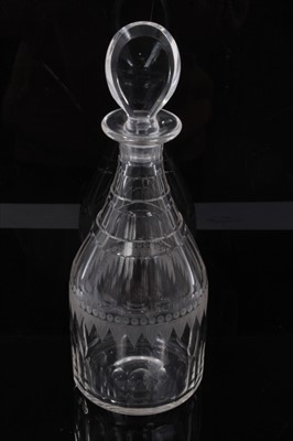 Lot 107 - Early 19th century cut glass decanter, of ovoid form with facet-cut decoration, etched circle and swag pattern around the middle, and a lozenge-shape stopper, 31cm height