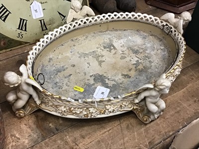 Lot 36 - Edwardian Mintons for Phillips blush ivory oval planter mounted with putti, with original tin liner