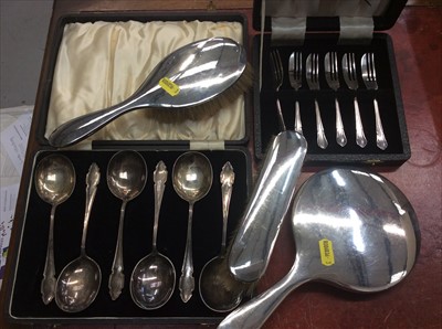 Lot 682 - Silver backed hand mirror, two silver brushes and two cased sets plated cutlery