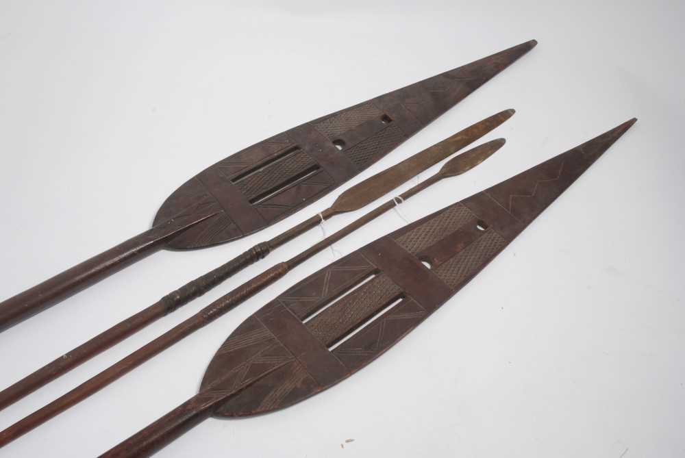 Lot 780 - Two Antique African Tribal spears, together with two African carved wood staffs (4)