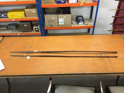 Lot 780 - Two Antique African Tribal spears, together with two African carved wood staffs (4)