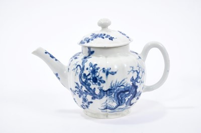 Lot 20 - Worcester teapot and cover, circa 1755, of lobed form, painted in blue with the Prunus Root pattern, 18cm length