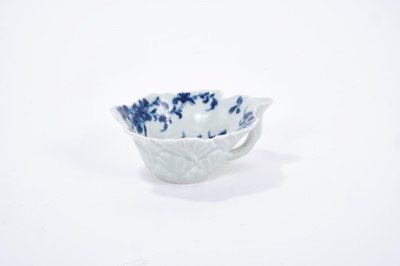 Lot 25 - Worcester butter boat, circa 1755, geranium moulded, painted with the Mansfield pattern, workman's mark to base, 8.5cm across