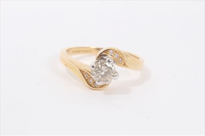 Lot 116 - 18ct gold diamond cross over ring