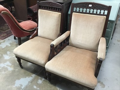 Lot 924 - Pair of Victorian 'his and hers' walnut and upholstered easy chairs