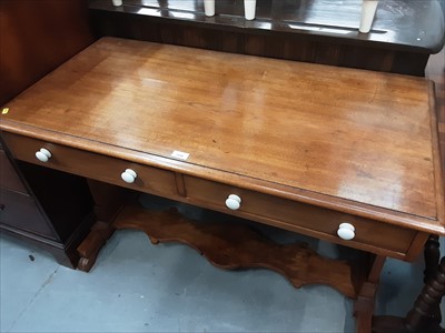 Lot 1056 - Continental mahogany writing table with two drawers