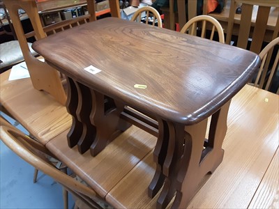 Lot 990 - Ercol three tier trolley together with a nest of three tables