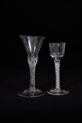 Lot 14 - 18th century wine glass with multi-spiral airtwist stem, together with an 18th century opaque twist glass with ogee bowl (2)