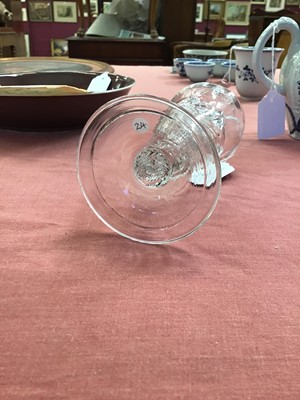 Lot 10 - Georgian flamiform wrythen ale glass, the moulded round funnel bowl on a folded conical foot, circa 1750, 13.75cm height