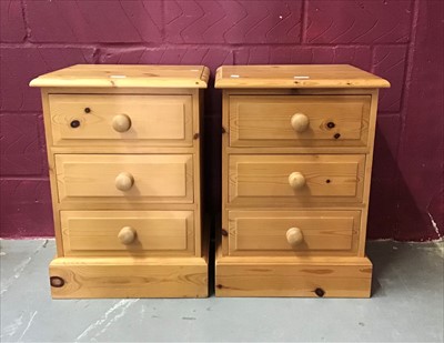 Lot 857 - Pair of pine three drawer bedside chests