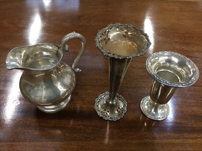 Lot 651 - Sterling silver cream jug and two sterling silver spill vases