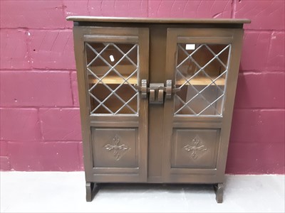 Lot 863 - Oak bookcase with two leaded glazed doors and panelled doors below