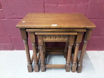 Lot 868 - Oak nest of three tables on turned and block legs