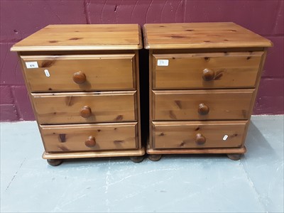 Lot 870 - Pair of pine three drawer bedside chests