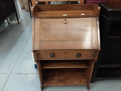 Lot 872 - Edwardian oak escritoire with single drawer and open shelves below