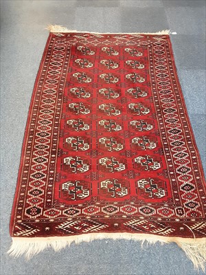 Lot 1071 - Eastern rug with geometric decoration on red ground