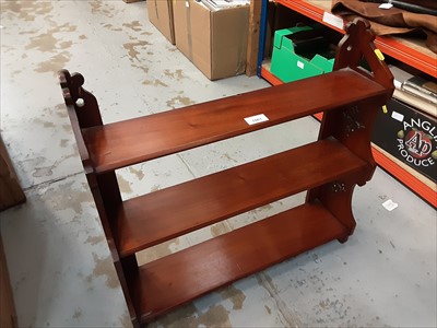 Lot 1061 - Hanging shelf together with a torchère