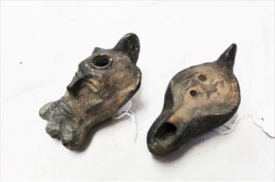 Lot 77 - Two Roman-style pottery oil lamps, one modelled with a bearded face