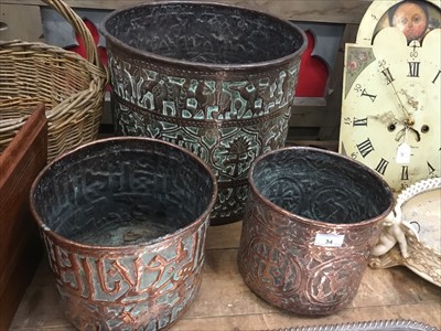 Lot 34 - Trio of Eastern antique brass jardinières decorated with animals, flora and motifs