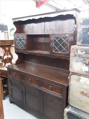 Lot 885 - Old Charm style oak two height dresser with leaded glazed cupboards above, three drawers and three panelled doors below