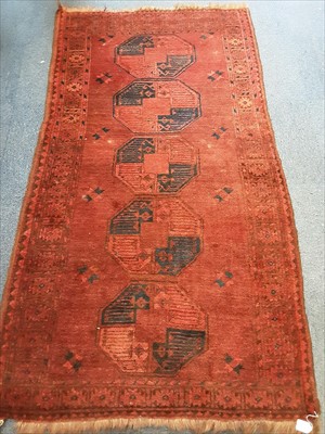 Lot 1078 - Old Afghan rug on red ground