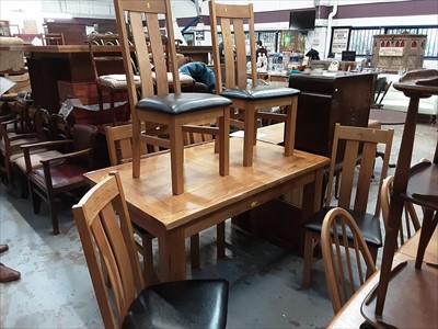 Lot 950 - Light oak extending dining table and six chairs