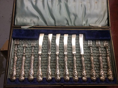 Lot 678 - Set twelve silver handled cake knives and forks in fitted case