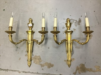 Lot 1087 - Pair of gilt two branch wall sconces