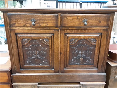 Lot 968 - Early 20th century oak sideboard with two drawers and two carved panelled doors below