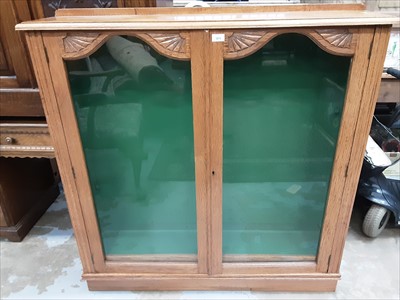 Lot 971 - Old oak bookcase with adjustable shelves enclosed by two glazed doors