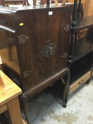Lot 984 - Queen Anne -style mahogany cocktail cabinet with interior tray on shell carved cabriole legs