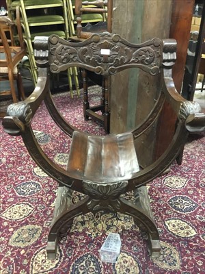 Lot 1046 - 17th century style carved oak x-frame armchair