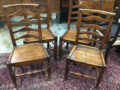 Lot 1047 - Set of four early 19th century ladder back chairs
