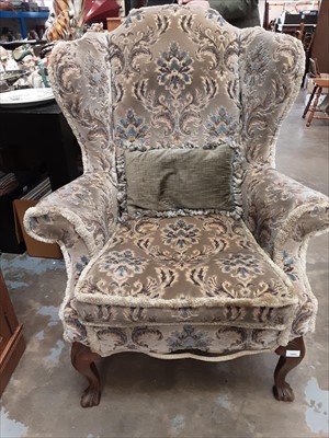 Lot 1002 - 1920s upholstered wing back armchair on walnut cabriole legs